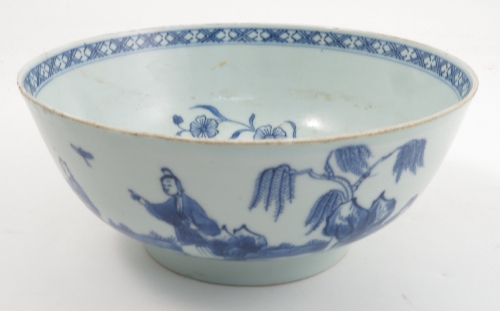 An 18th century Chinese export bowl, the exterior decorated in underglaze blue with figures catching