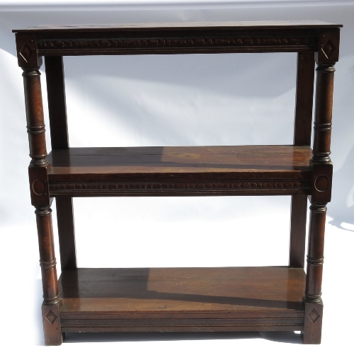 An oak three tier buffet, in the early 18th century style, bearing label 'R Morgan Ltd of