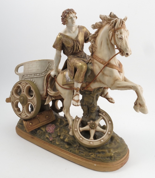 An Amphora Austria blush model, of a man riding a horse with chariot behind, model number 5107,