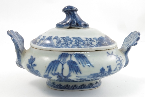 A 19th century Chinese export covered tureen, decorated in underglaze blue with a landscape and