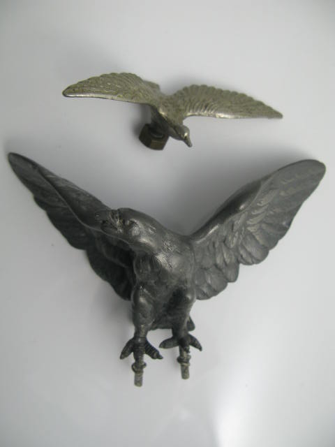 Two Cast Metal Eagle Ornaments