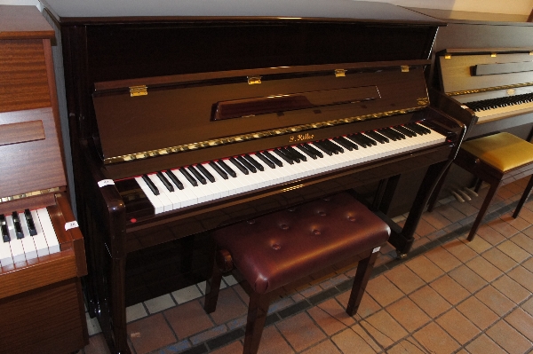 Ritter (c2008)
An upright piano in a traditional style bright mahogany case, together with a stool.