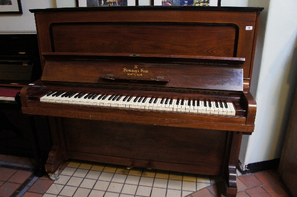 Steinway (c1907)
A Vertegrand upright piano in a rosewood case.