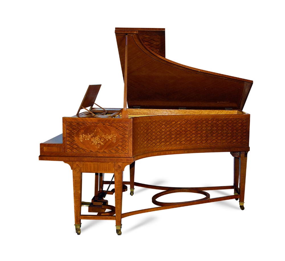 Erard (c1910) 
A 7ft grand piano in a walnut parquetry case decorated with foliate panels, raised on