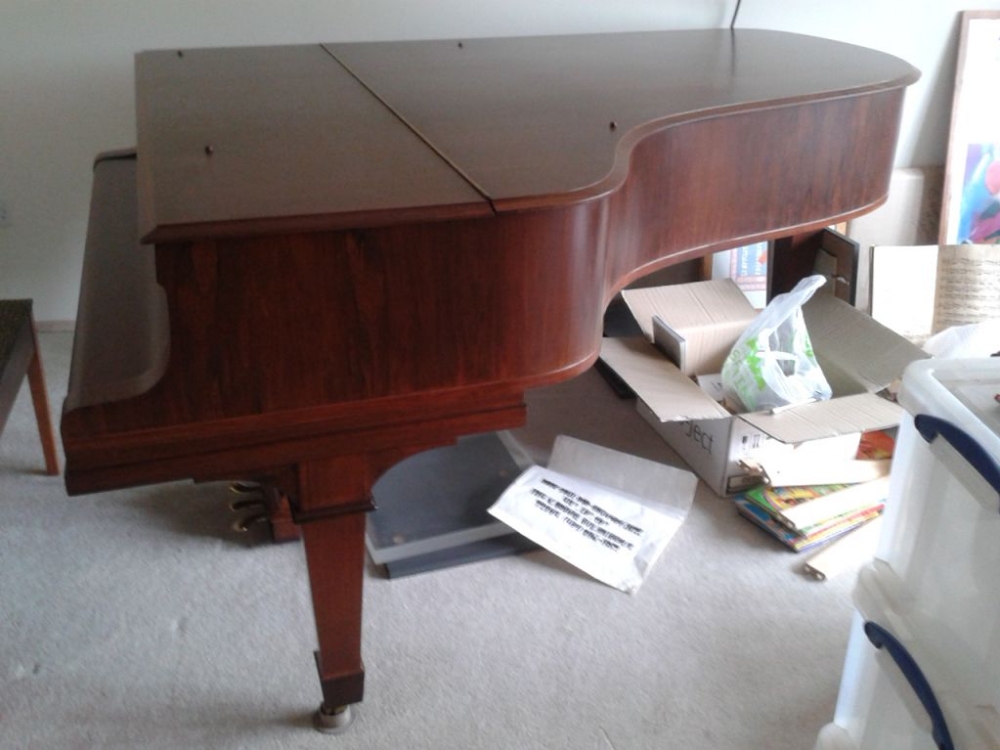 Steinway (c1913) 
A 6ft 11in Model B grand piano in a rosewood case on square tapered legs. This