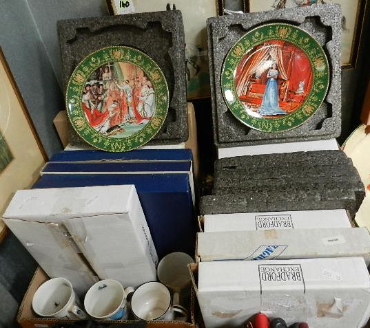 Two boxes of assorted collector's plates mainly military interest, boxed with certificates