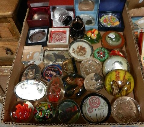 A collection of assorted paperweights, some boxed