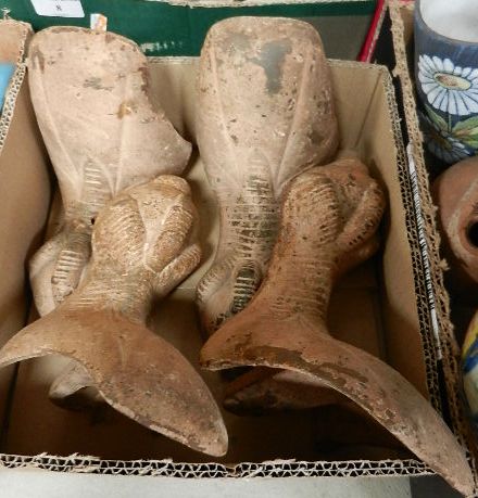 A set of four early 20th century cast iron claw and ball roll top bath feet