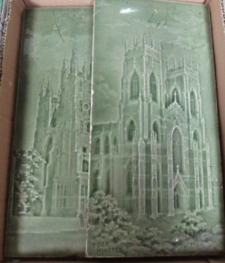 A pair of early Minton green glazed tiles depicting Canterbury Cathedral and York Minster