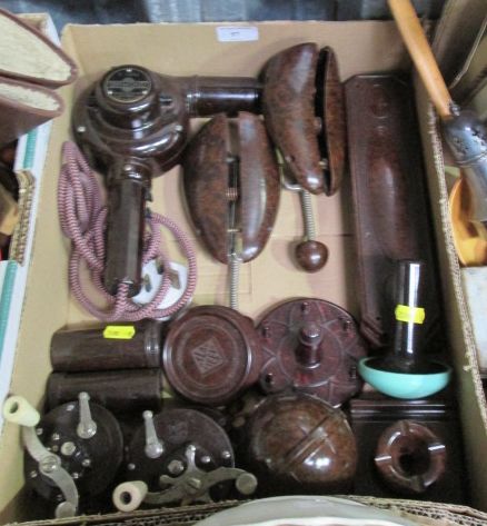 A collection of assorted Bakelite items to include a string ball, castors, a hair dryer, a sewing