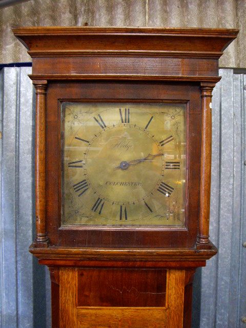 A 19th century oak longcase 30-hour clock, the hood with moulded cornice and plain frieze, with