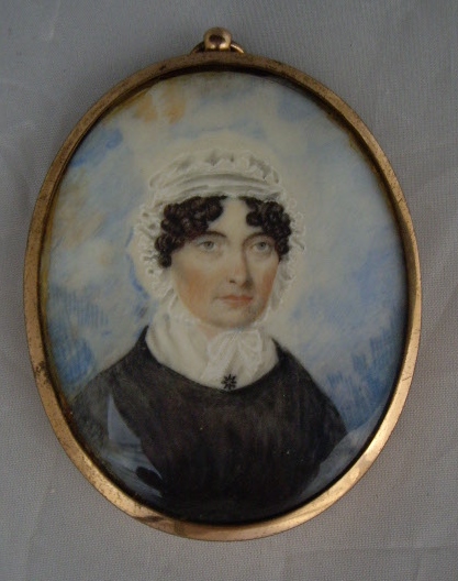 An oval portrait miniature on ivory of a Georgian lady, housed in a gilt metal frame, 7cm x 5.