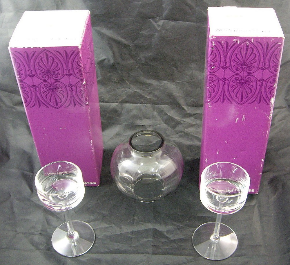 A pair of boxed Wedgwood clear glass 'Brancaster' candlestick holders designed by Ronald Stennett-