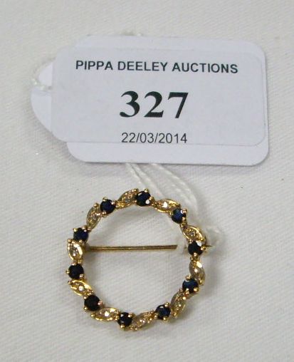 A 9 carat gold, diamond and sapphire wreath brooch, 2.6g