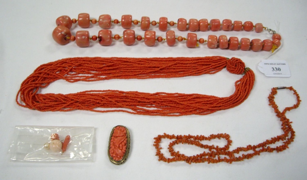 An early 20th century multi-strand coral necklace, a modern pink coral necklace (stained), a coral