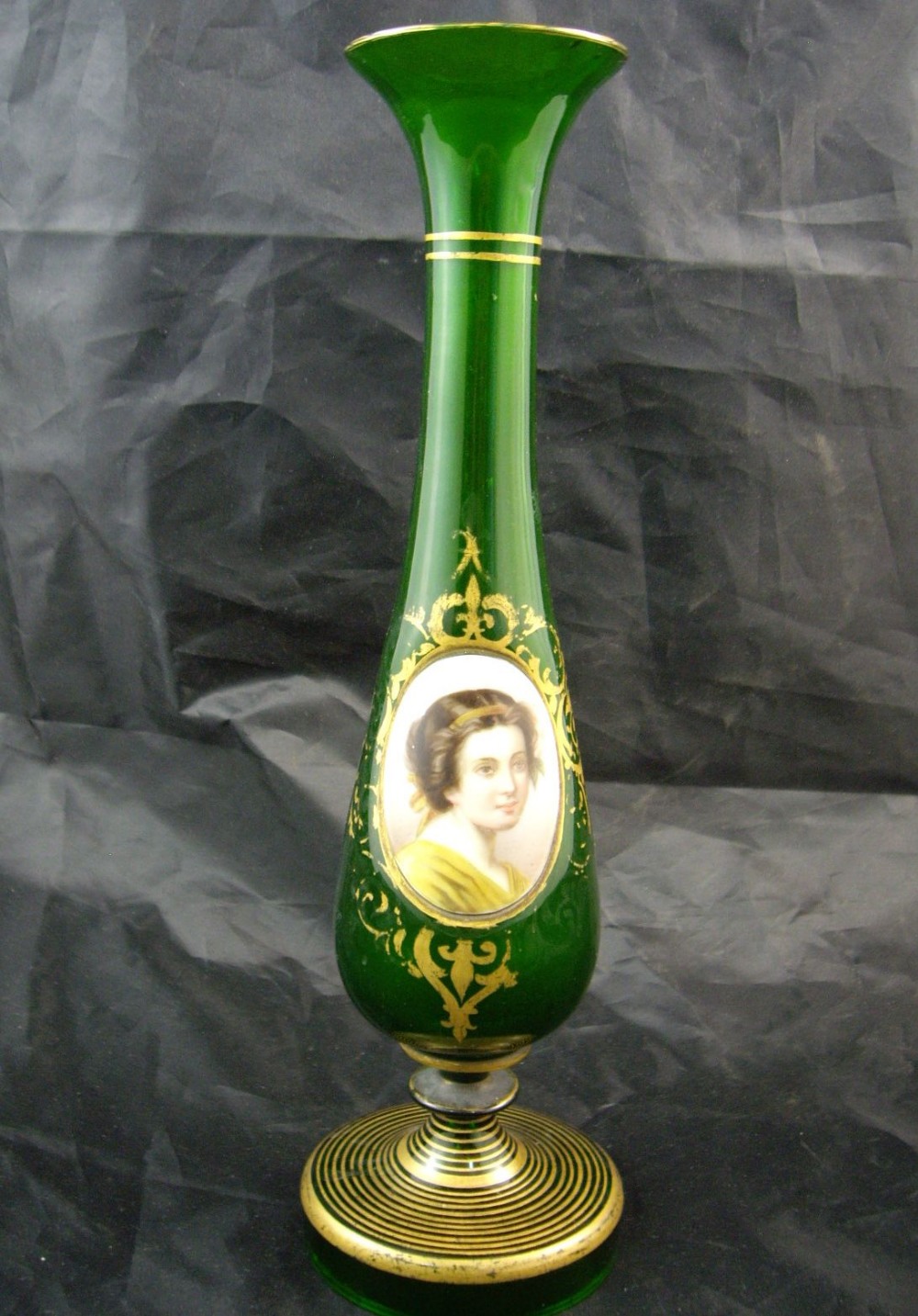 A green Bohemian glass vase applied with a hand painted oval portrait miniature on white glass