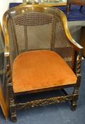 An oak framed `Bergere` style cane chair and another a/f