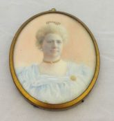 A 19th century portrait miniature of a lady with gold necklace