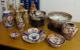 Various Chinese and Japanese vases and bowls including badly damaged punch bowl and two wood stands