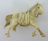 Carved ivory horse, 8cm high