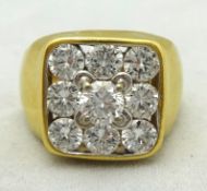 A cushion shaped all diamond set cluster ring with nine brilliant cut diamonds (one raised),