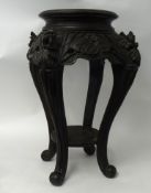 A carved wood jardinière stand with cabriole legs circa 1900, 78cm high