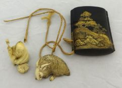 A four case Japanese lacquered and gold Inro having landscape design with carved ivory netsuke