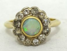 An opal and diamond cluster ring, size M