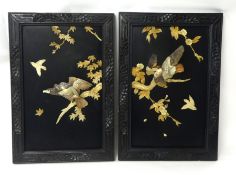 Pair of Chinese lacquered panels decorated in relief with bone and mother of pearl bird scenes,