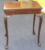 Mahogany card table on cabriole legs with ball claw feet
