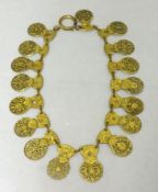 An unusual necklace formed from 19th century pocket watch gilt back plates, 17 in total, 38cm
