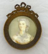 19th century circular portrait miniature, in gilt frame with label to verso `Dubarry`