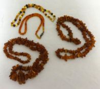 Four various amber necklaces