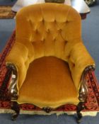 A Victorian upholstered and mahogany framed armchair