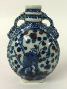 Chinese blue, white and iron red snuff bottle with 4 character mark to base
