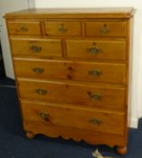 A pine chest fitted with eight drawers