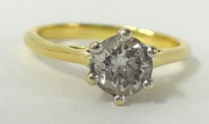 An 18ct gold diamond solitaire ring, approx 0.76 carat, size O, together with copy of insurance