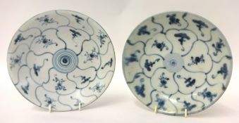 TEK SING CARGO two blue and white circular saucer dishes of lotus form painted in two concentric