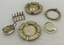 Pair of silver ashtrays, embossed silver mustard pot, toast rack and two other ashtrays (6)