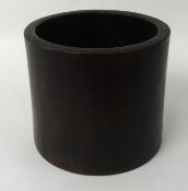 A large hardwood brush pot, bitong, with later plug, 21cm high, possibly Chinese