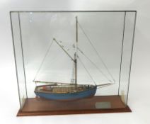 A model of a Cornish coastal barge `Mystery` in glazed cabinet 54cm x 59cm x 15cm