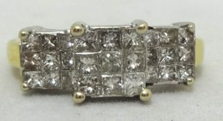 A diamond square cluster ring set with 27 diamonds arranged in three squares, stamped 18k, approx