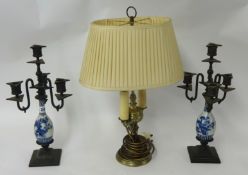 Pair of bronze candelabra set with blue and white porcelain of Chinese design also a brass table