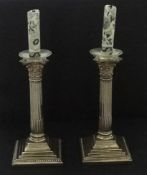 Pair of silver column candlesticks, 21cm