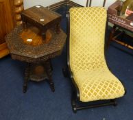 A small finely carved occasional table, ebonised nursing chair and small stool (3)