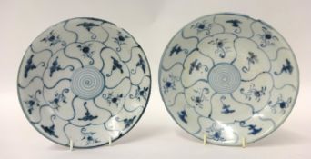 TEK SING CARGO two blue and white circular saucer dishes of lotus form painted in two concentric