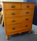 A late Victorian chest of drawers fitted with two short and three long drawers