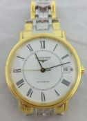 A Gents Longines wrist watch in yellow metal and stainless steel, as new with original boxes and