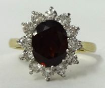 A 9ct ruby and diamond style cluster ring , size R