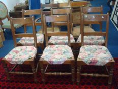 Set of six `Country` dining chairs with rush seats and bar backs t/w a similar elbow chair and